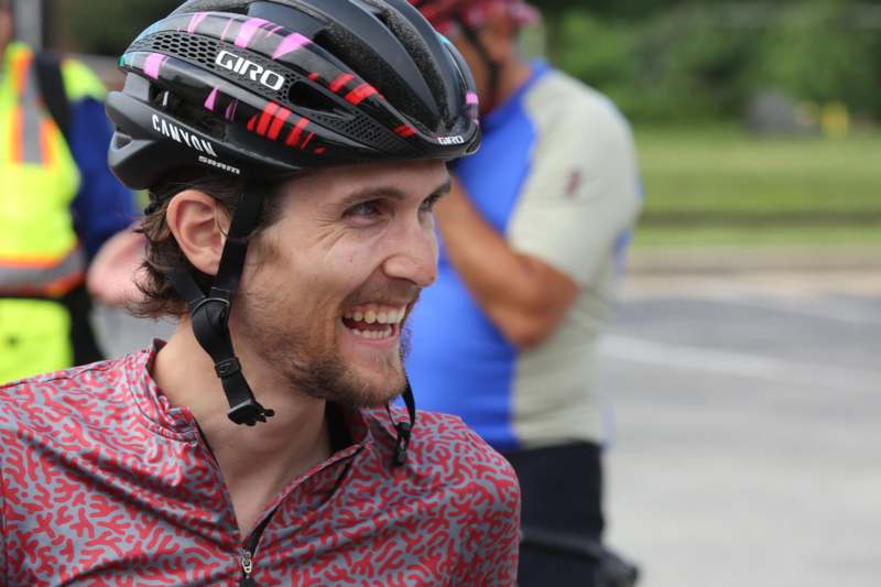 a man wearing a helmet smiling