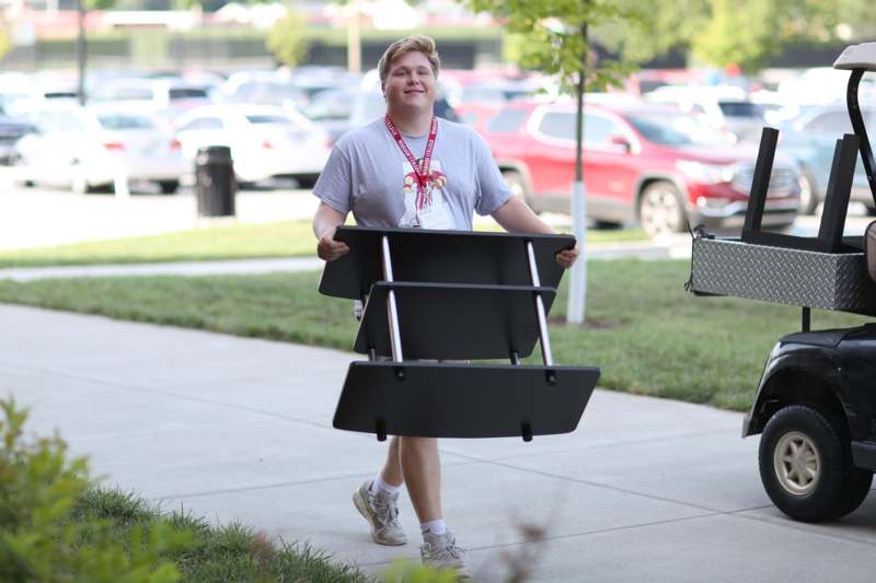 a person carrying a table