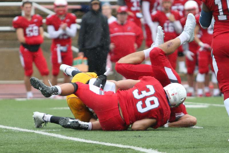 a football player falling on the ground