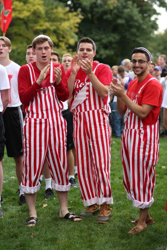 a group of men in striped overalls