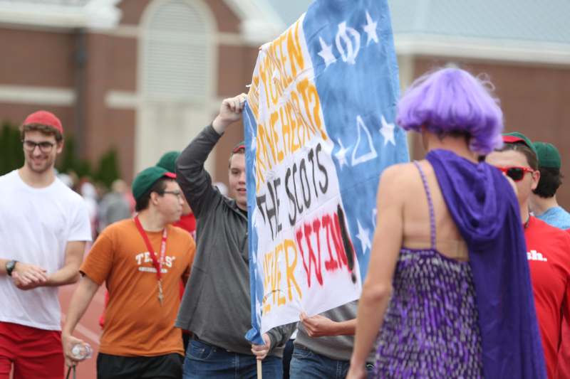 a group of people holding a sign
