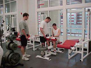 a group of men working out in a gym