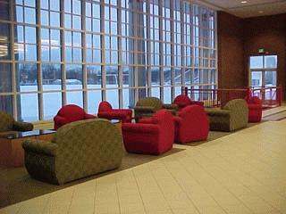 a room with many chairs and a table