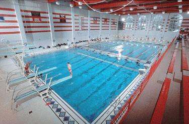 a swimming pool with people in it
