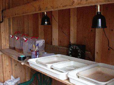 a room with white containers and a wooden wall