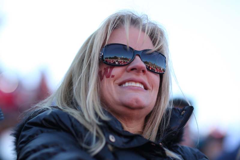 a woman wearing sunglasses and a jacket