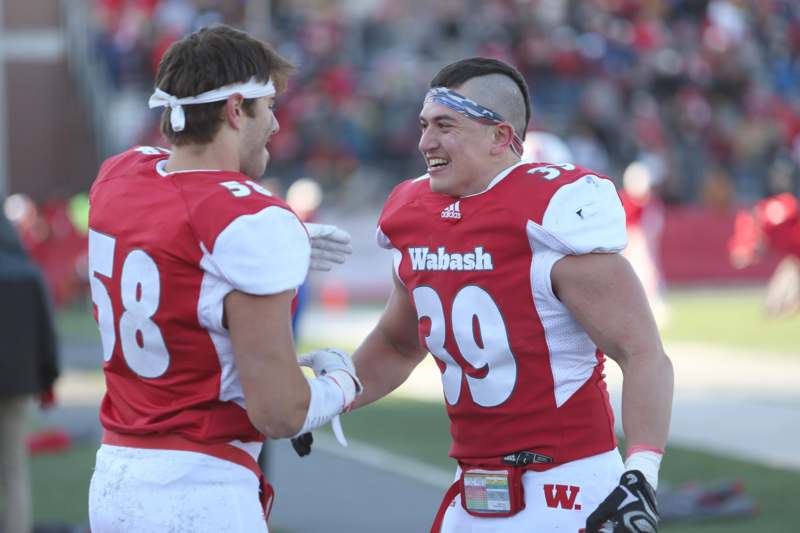 two football players in red and white uniforms