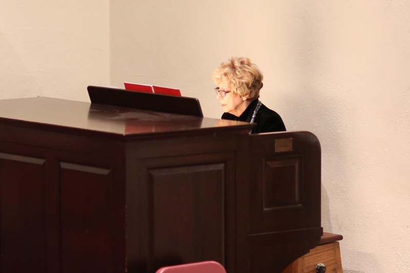 a woman sitting at a podium