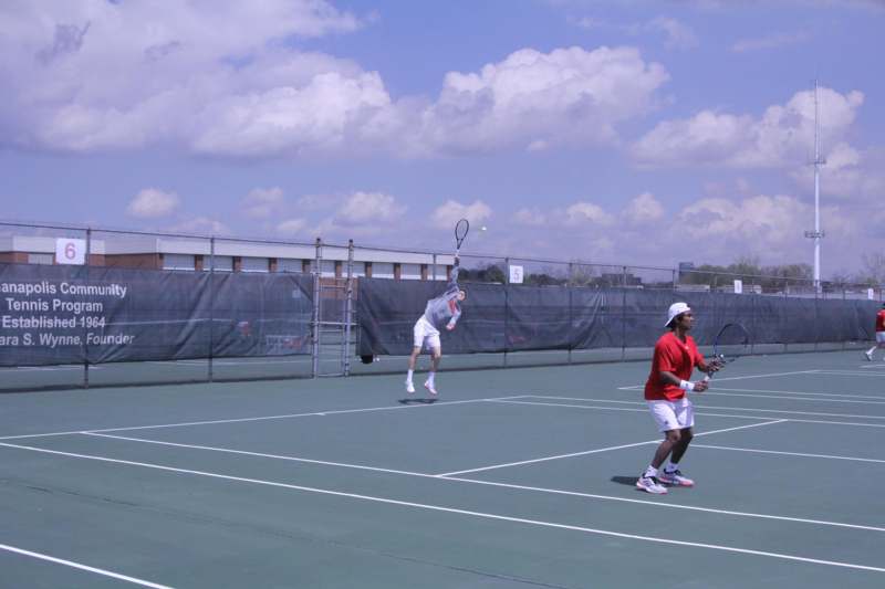 a couple of men playing tennis