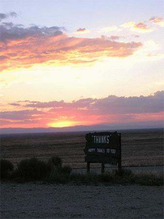 a sign in the middle of a field