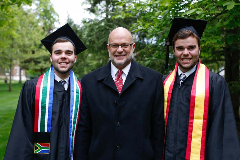 a group of men wearing graduation caps and gowns