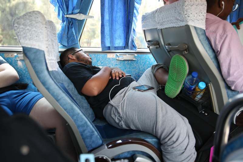 a man sleeping in a train