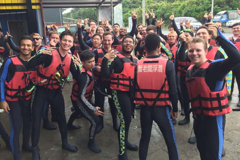 a group of people wearing life jackets