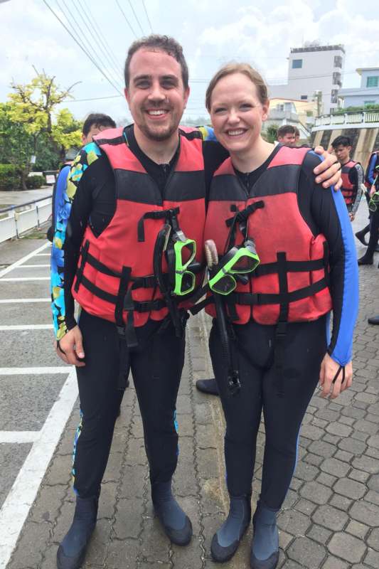 a man and woman wearing life jackets