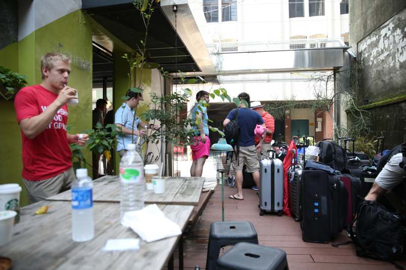 a group of people outside with luggage