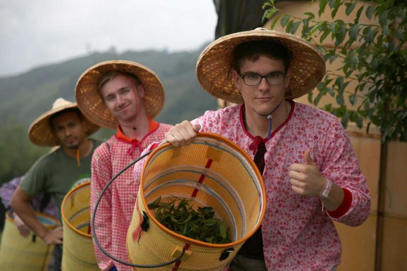 a group of men wearing hats and holding baskets