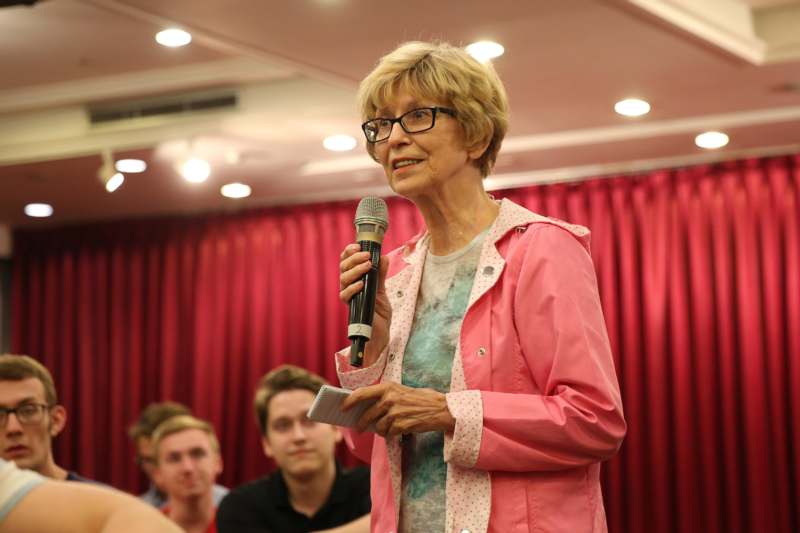 a woman holding a microphone