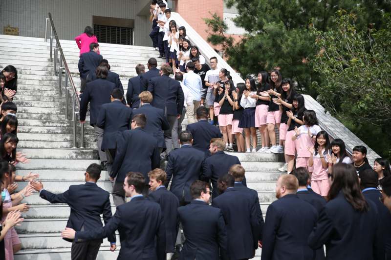 a group of people standing on stairs