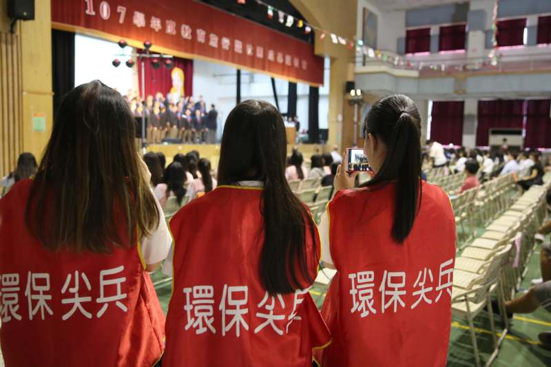 a group of women wearing red shirts