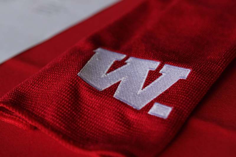 a red fabric with a white w on it