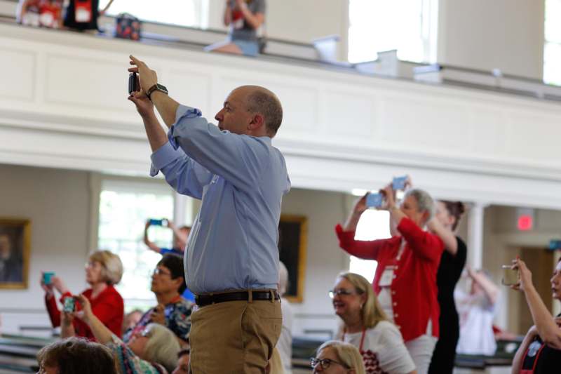 a man taking a picture of a group of people