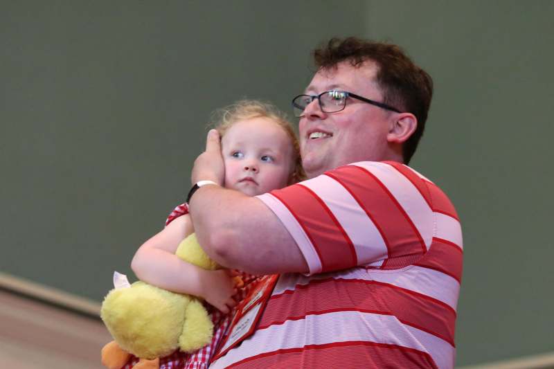 a man holding a baby