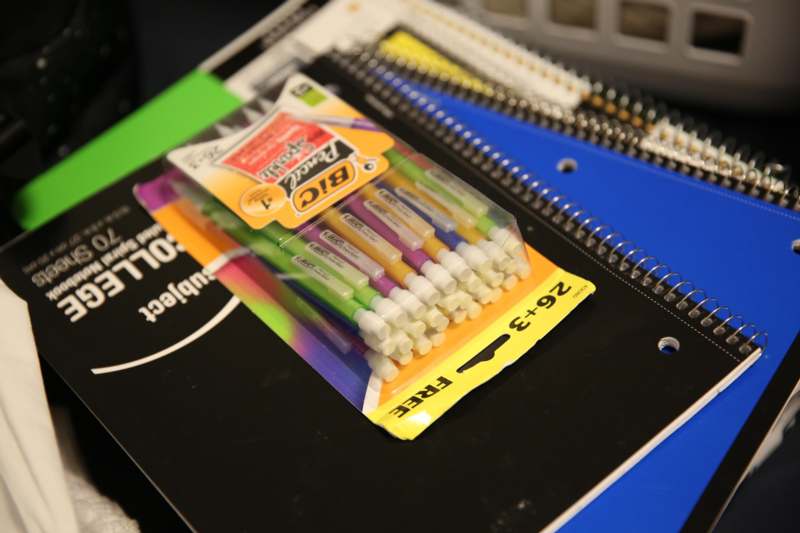 a pack of pens on a notebook