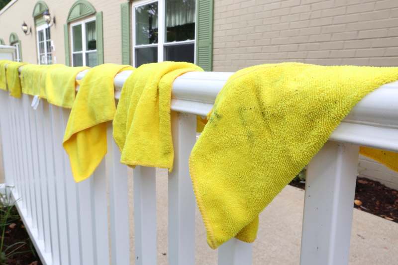 yellow towels from a railing