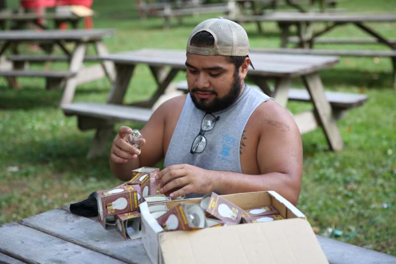 a man sitting at a picnic table