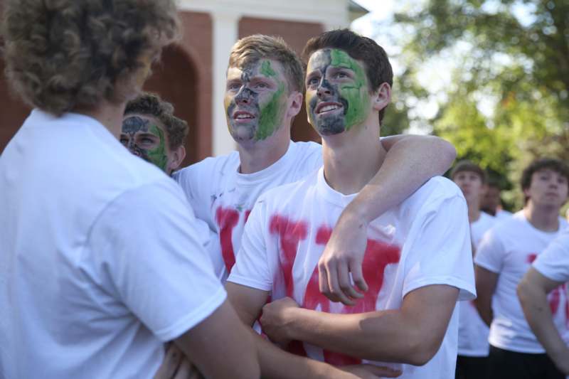 a group of young men with paint on their faces