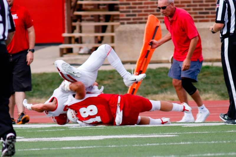 a football player falling on the ground