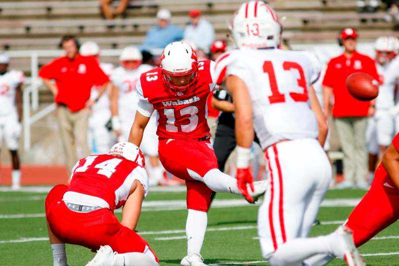 a football player in red and white uniform