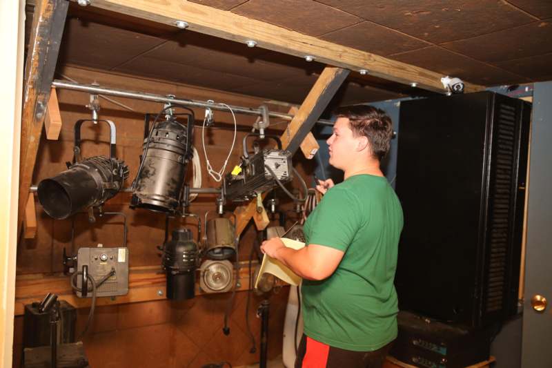 a man standing in a room with equipment