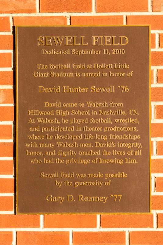 a plaque on a brick wall