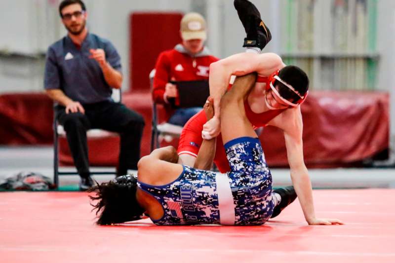 a man wrestling on a mat