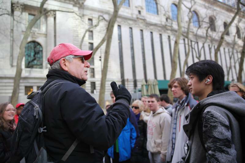 a man talking to a group of people