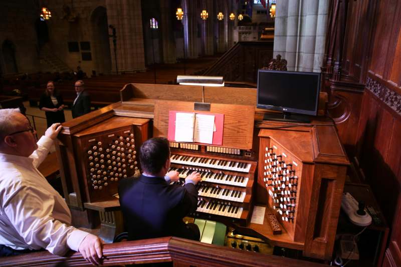 a man playing a organ