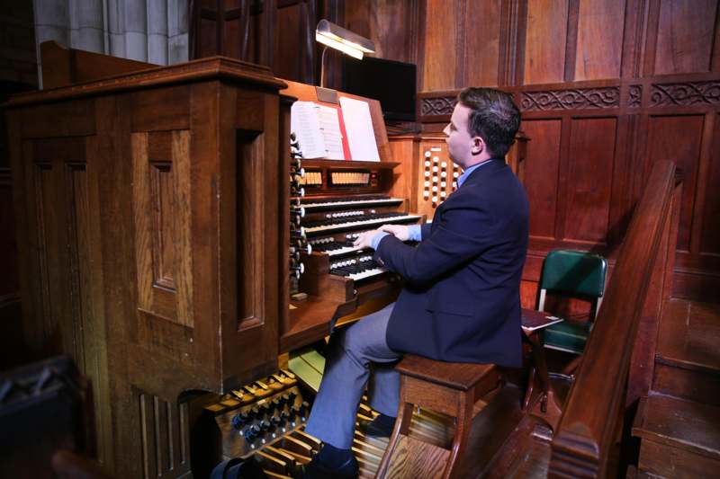 a man playing an organ