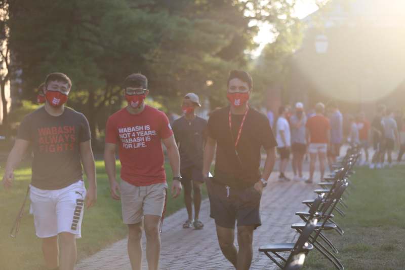a group of men wearing face masks