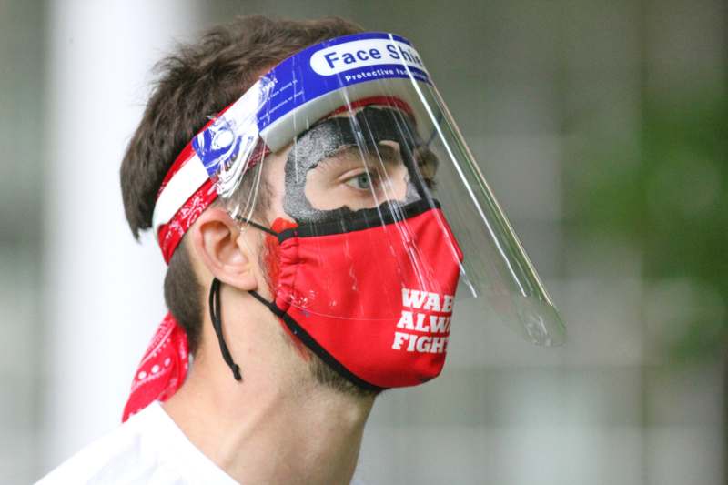 a man wearing a face shield