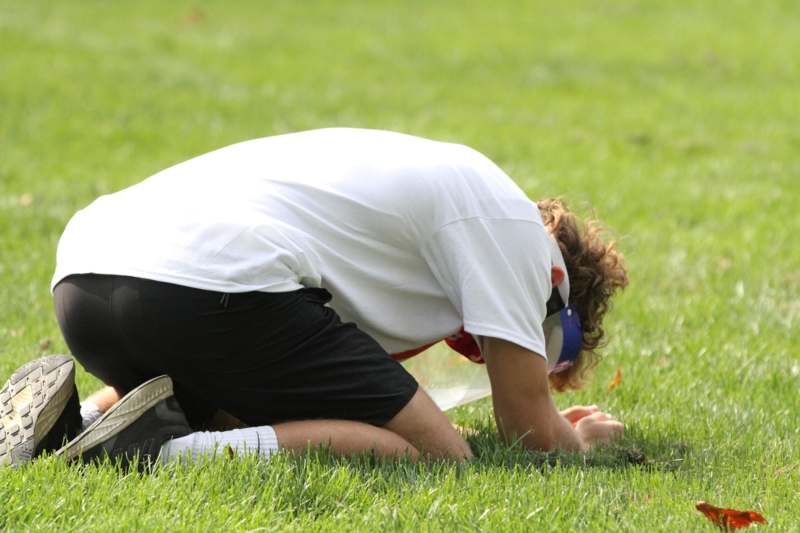 a man kneeling on the ground