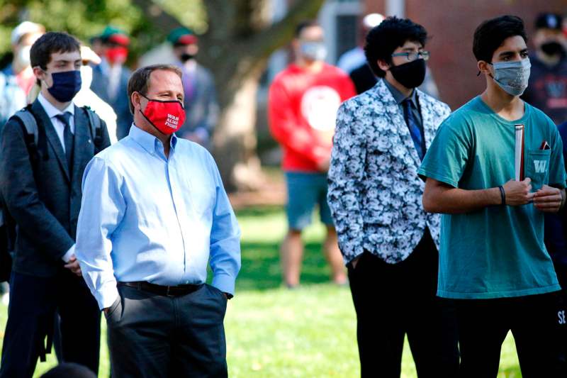 a group of people wearing face masks