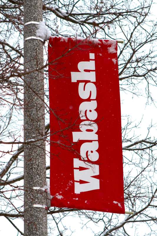 a red banner on a pole
