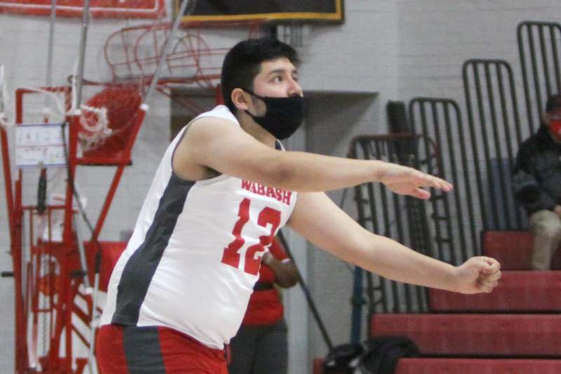 a man wearing a face mask and holding a frisbee