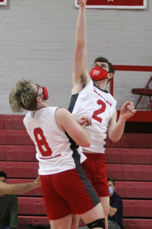 a group of men playing basketball