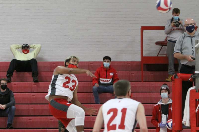 a group of people playing volleyball
