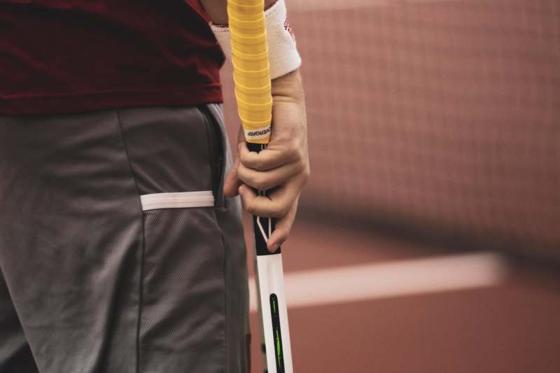 a person holding a tennis racket