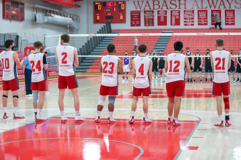 a group of men in uniforms on a volleyball court