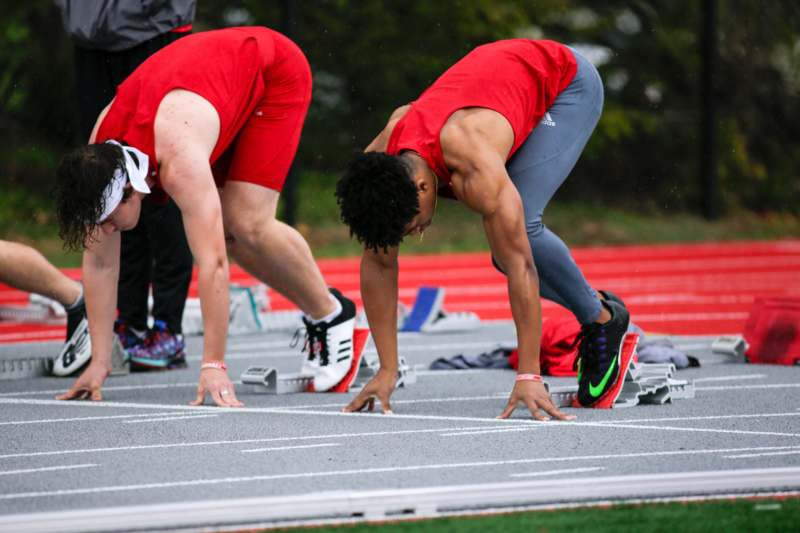 a group of men on a track