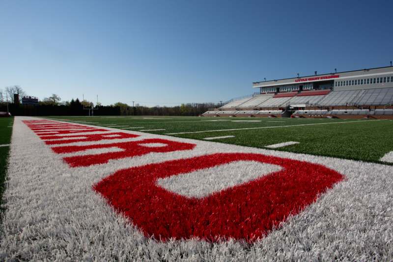 a football field with a red and white number on the side